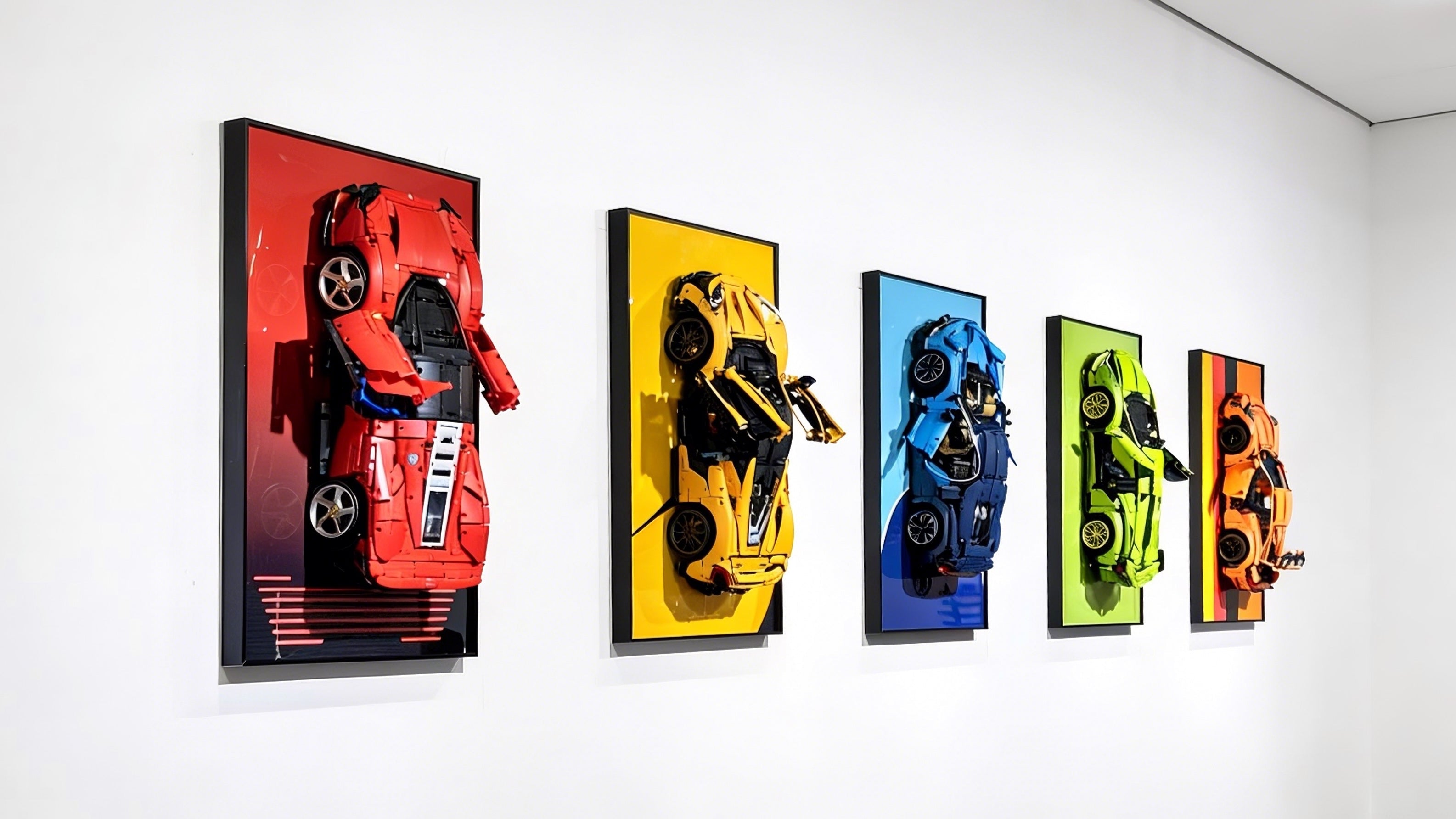 Five LEGO Technic Supercar car models  with wall display on a white wall