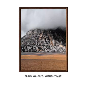 Framed artwork with a black walnut frame and white mat on a white background. Black walnut beveled frame without mat. 