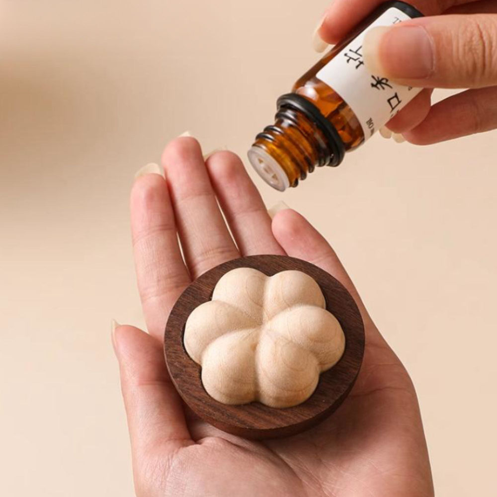 Wooden mangosteen shape diffuser on a white background