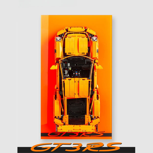 LEGO Orange Porsche 911 GT3 RS model car on an orange acrylic wall display