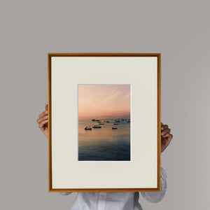 Person holding a teak beveled picture frame lifestyle shot