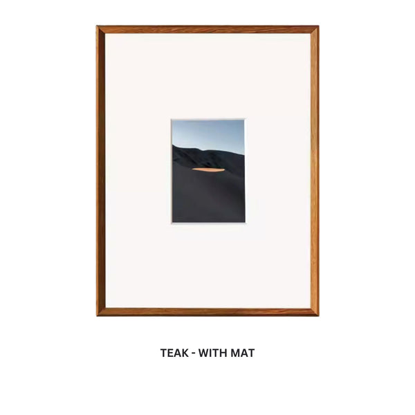 Framed artwork with a teak frame and white mat on a white background. Teak beveled picture frame with mat. 