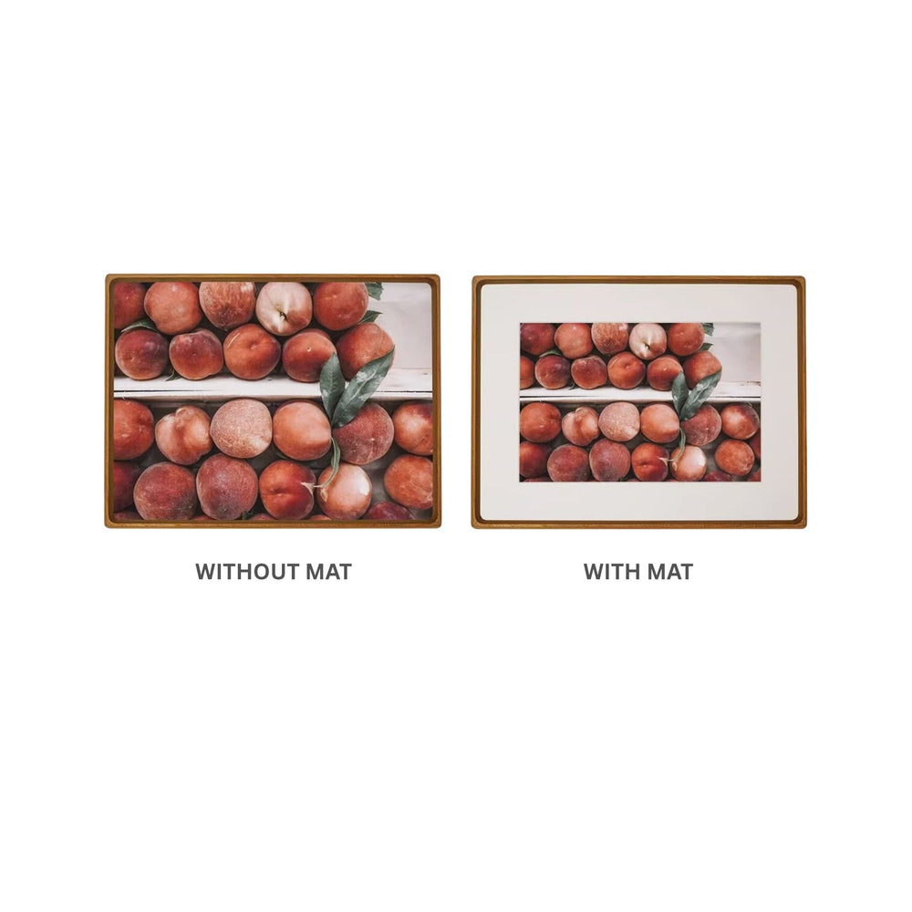 Two teak framed pictures side by side, one without a mat and one with a mat, on a white background.