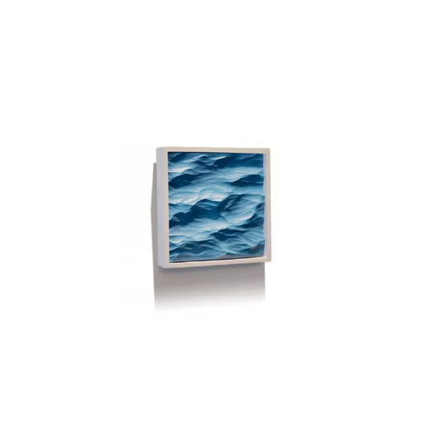 Thin white framed artwork on a blue wave pattern on a white background