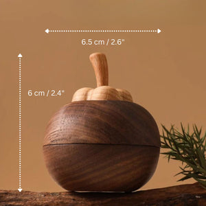 Wooden mangosteen shaped diffuser, showing dimensions against a brown background