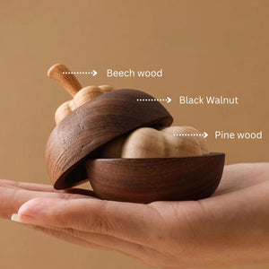 Wooden mangosteen shaped difuser made with beech wood, black walnut, and pine wood components.
