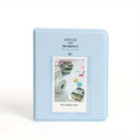 Light blue photo album with a small window displaying a camera and photos on a white background